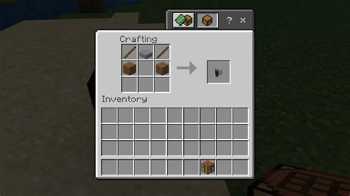 How do i make a grindstone in minecraft